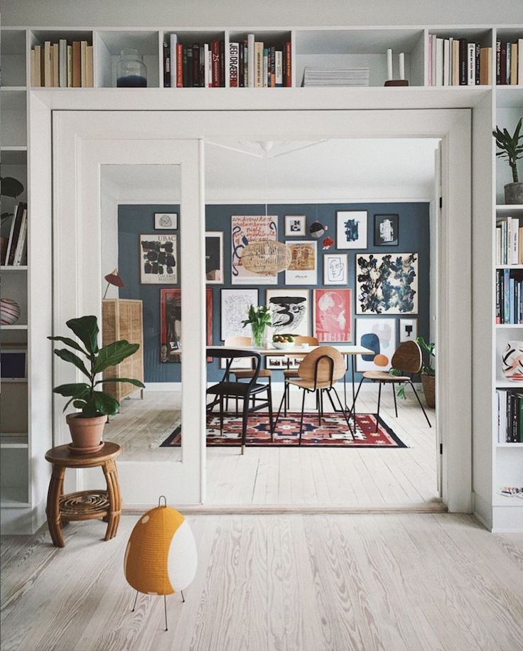 Double doors, book shelves an gallery wall in An A…