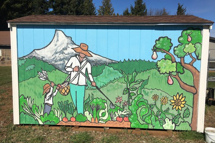A mural of a Latinx farmer at Raices Cooperative Farm.