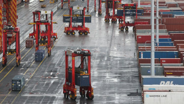 An automated terminal at Port Botany, where machines load vast volumes of goods onto ships without touching human hands. A recent OECD survey shows more than a third of Australian teenagers want to work in areas at risk of being replaced by machines.