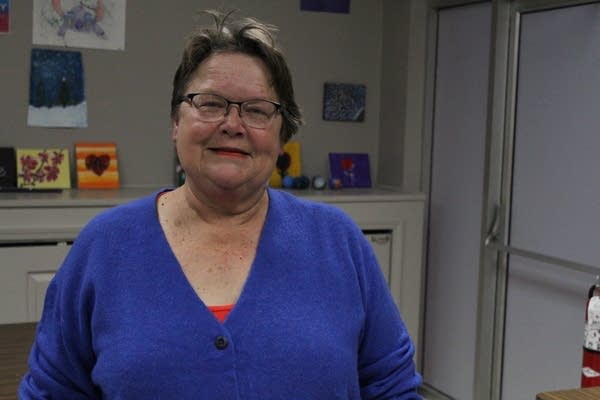 A woman stands for a picture