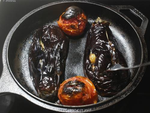 broiled eggplants tomatoes in a pan
